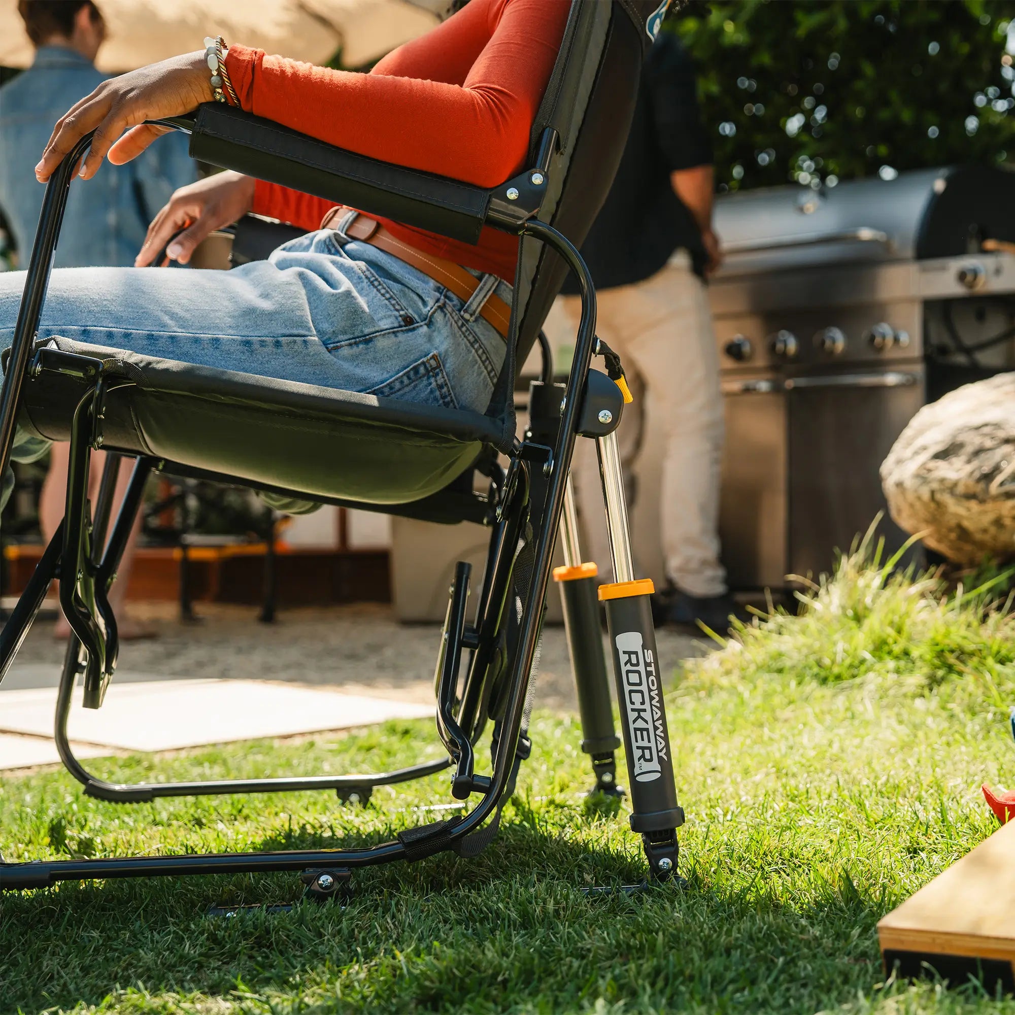 An up-close of the gray tailgater stowaway rocker spring action rocking technology.