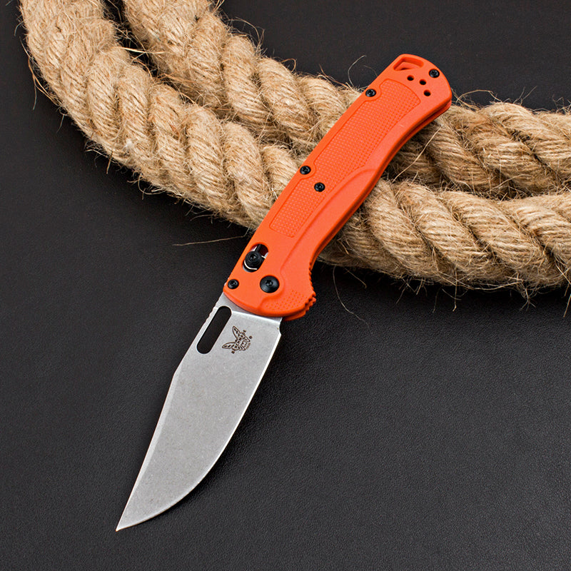 Axis-lock folding knife with fiberglass handle