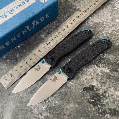 Ball-bearing folding knife with carbon fiber handle and S90V steel blade—a high-hardness, portable, multi-functional tool for camping and outdoor use.