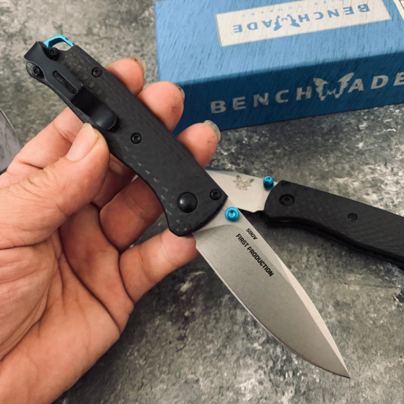 Ball-bearing folding knife with carbon fiber handle and S90V steel blade—a high-hardness, portable, multi-functional tool for camping and outdoor use.