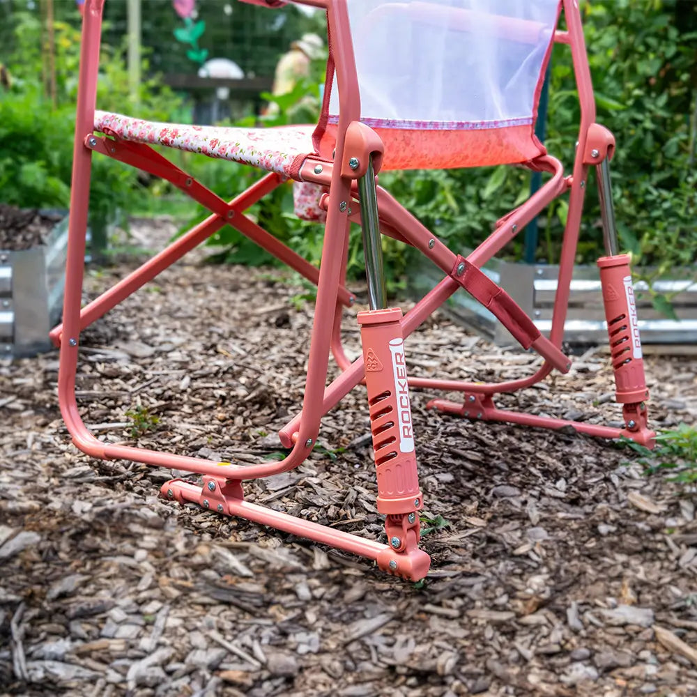 An up close angle of the spring action rocking technology on a pink freestyle rocker elite. 