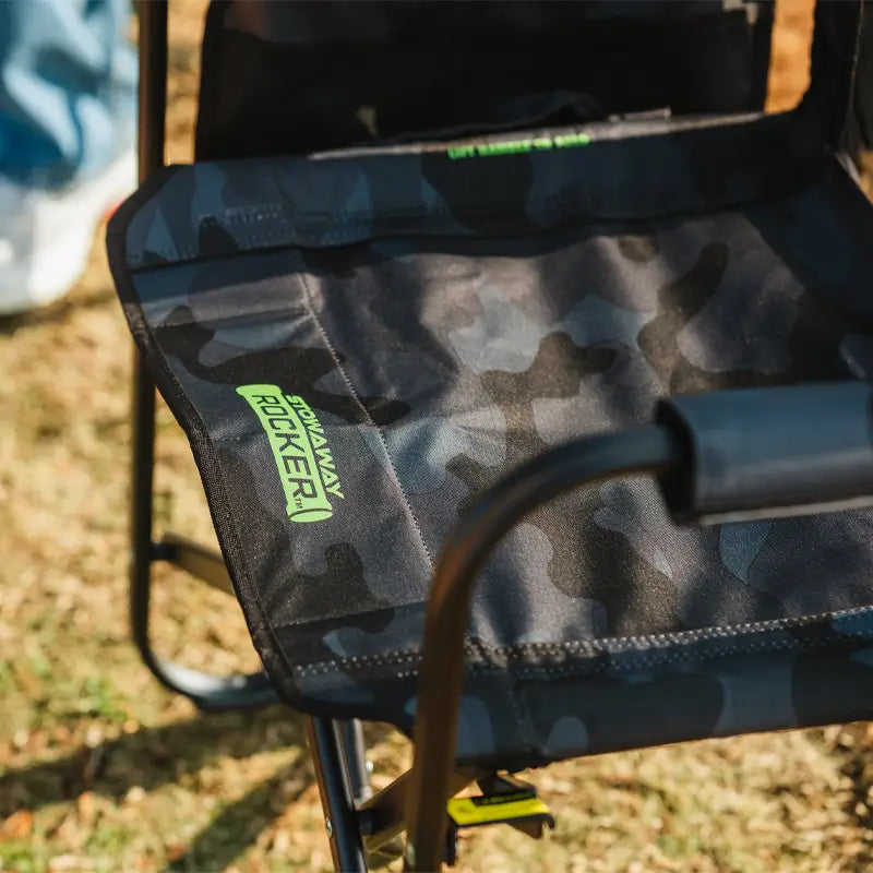Close-up of the stealth camo Stowaway Rocker seat with a visible "Stowaway Rocker" logo in green.